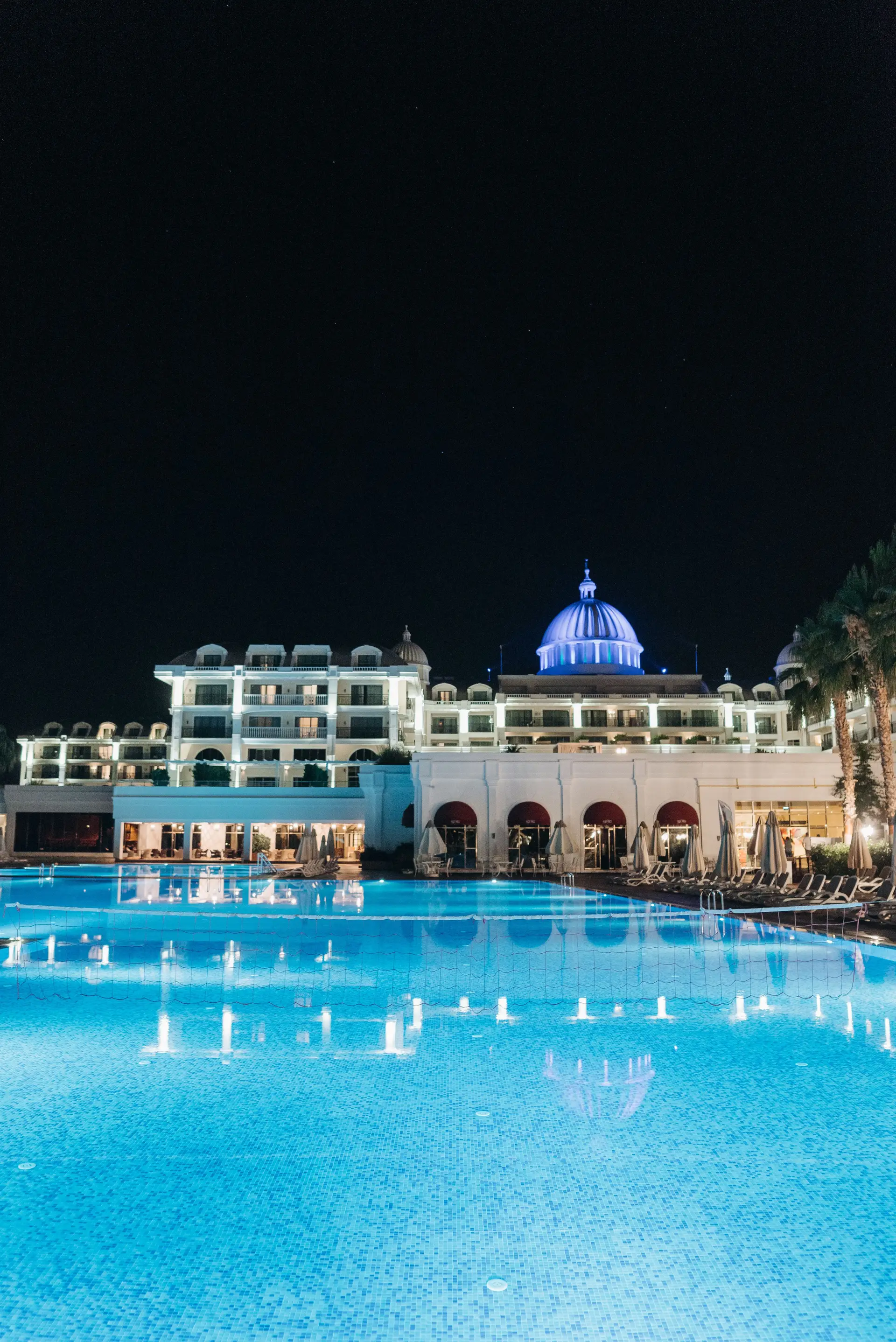 VelmarenroyalManor luxury pool and architecture at night